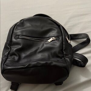Sleek Black Faux Leather Backpack